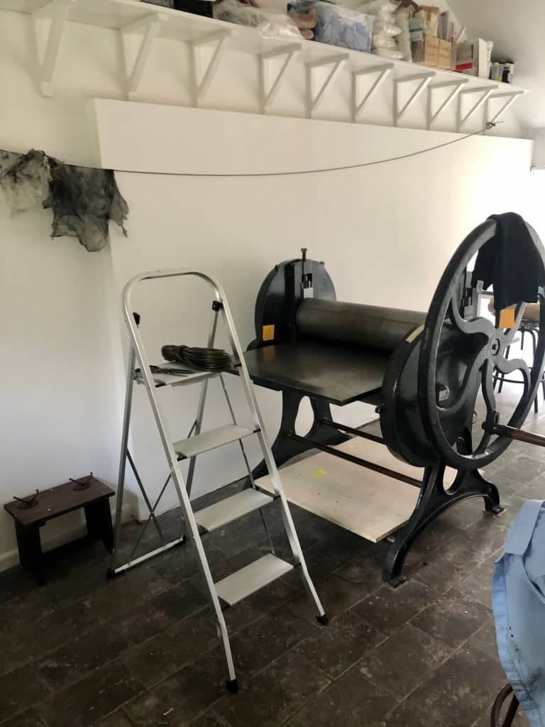 The Rochat etching press with its star wheel in the white-walled studio at Rose Farm Barn